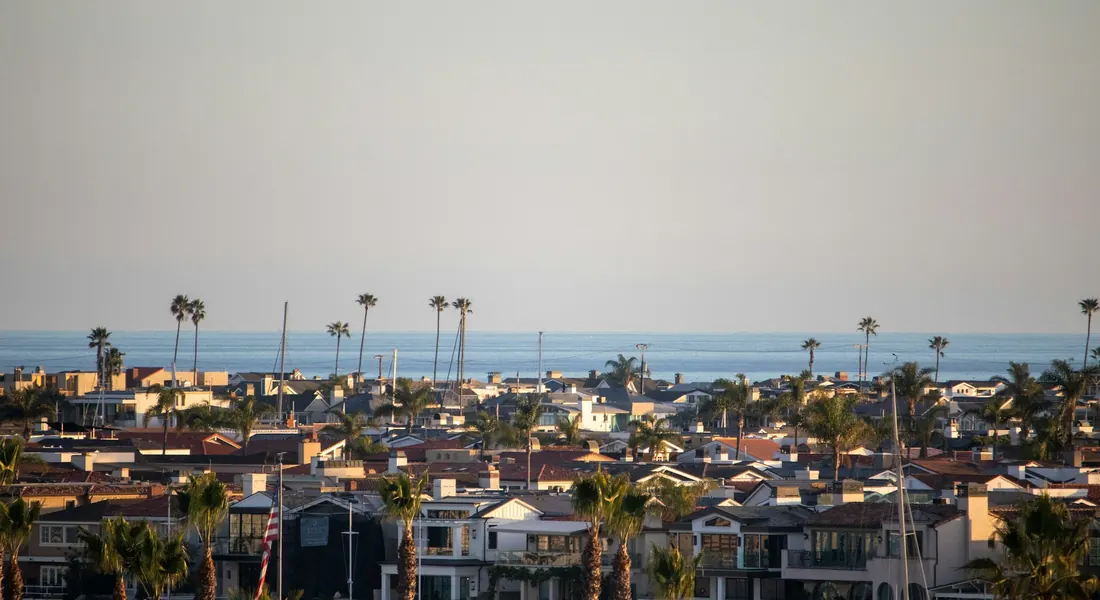 Palm-lined Newport Beach neighborhood with the Pacific Ocean beyond